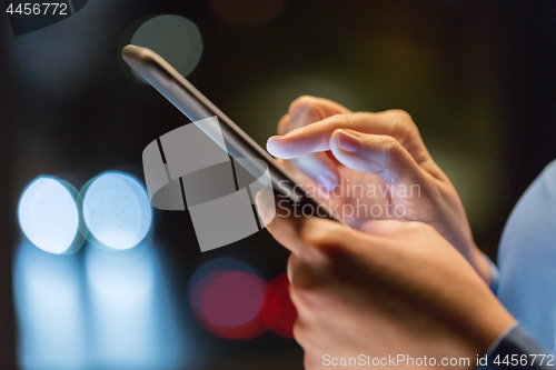 Image of close up of businesswoman hands with smartphone