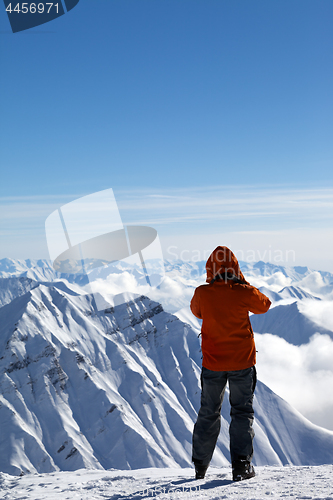 Image of Skier on top of snow mountains