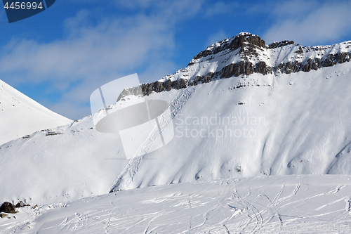 Image of Off-piste slope with traces of skis, snowboards and avalanches