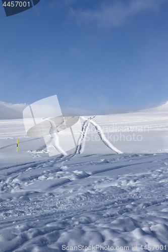 Image of Off-piste ski slope with new-fallen snow and traces from skis, s
