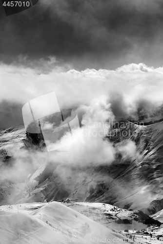 Image of Black and white view on ski resort in mist and sunlight sky befo