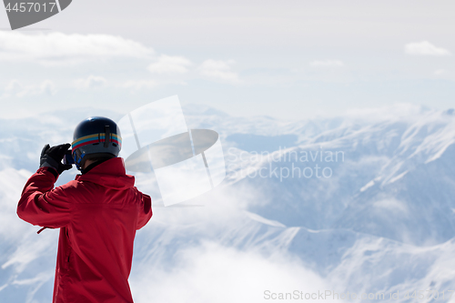 Image of Snowboarder makes photo on camera 