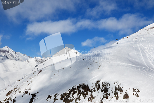 Image of Off-piste slope and chair-lift on ski resort 