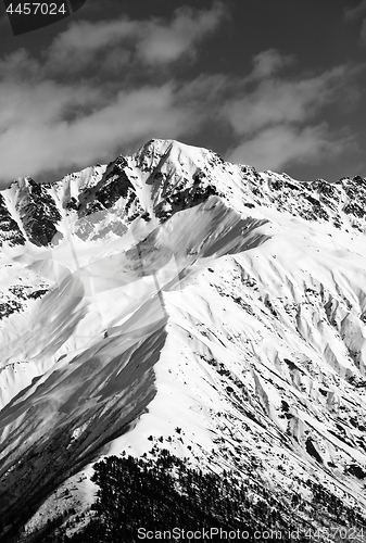 Image of Black and white snow mountain peak at sunny day