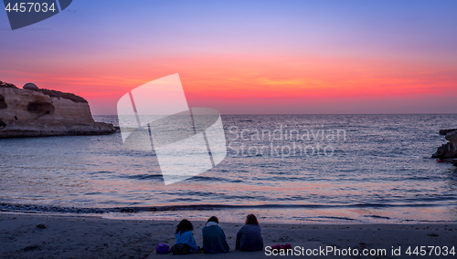 Image of Three friends looking to the sunrise