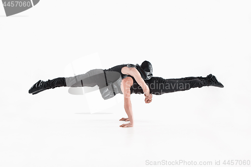 Image of The group of gymnastic acrobatic caucasian men on balance pose