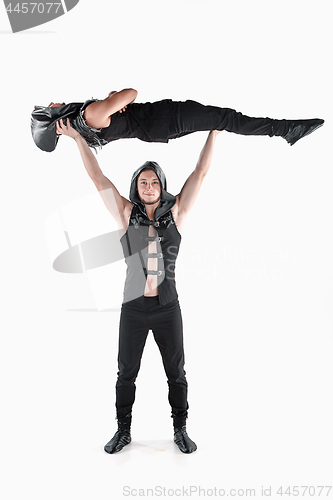 Image of The group of gymnastic acrobatic caucasian men on balance pose