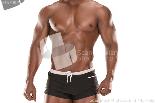 Image of Fit young man with beautiful torso isolated on white background
