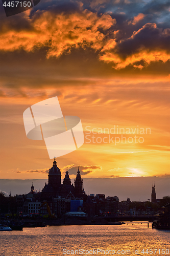 Image of Amsterdam cityscape skyline with  Church of Saint Nicholas on su