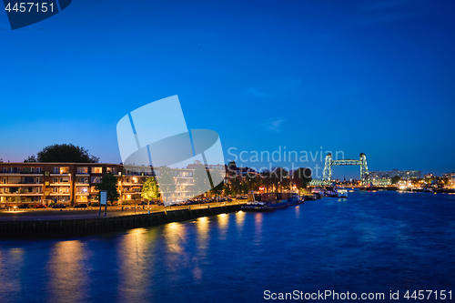 Image of Rotterdam cityscape with De Hef bridge and Noordereiland at nigh