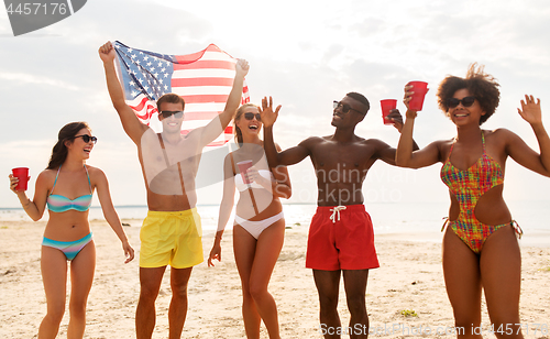 Image of friends at american independence day beach party