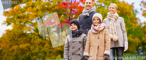 Image of happy family over autumn park background