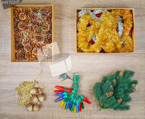 Image of Traditional christmas tree decorations including baubles, fir cones.