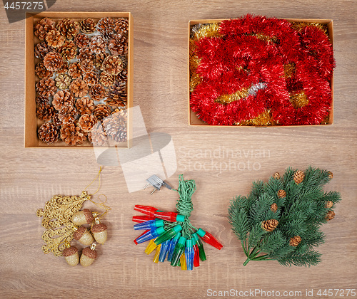 Image of Traditional christmas tree decorations including baubles, fir cones.