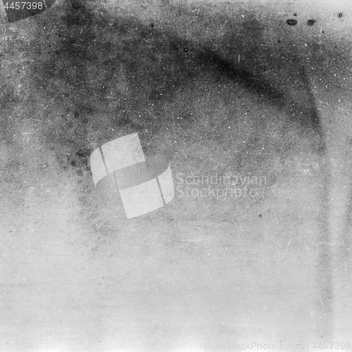 Image of Black and white textured background with light leaks and grain.