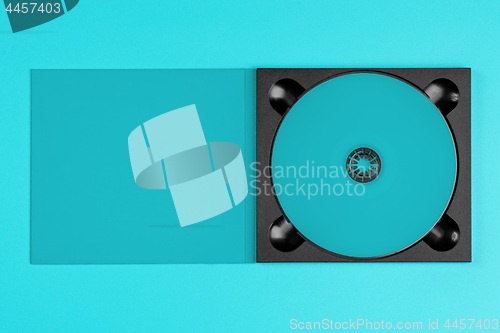 Image of pastel green cd in case on pastel green background.