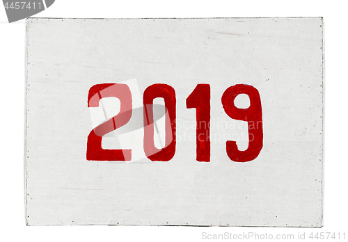 Image of New year 2019 painted on plywood board. Year of the Pig.