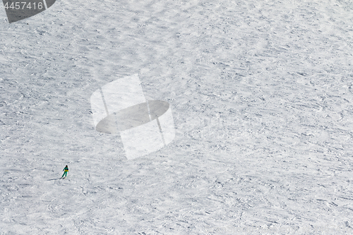 Image of Skier downhill on snow slope