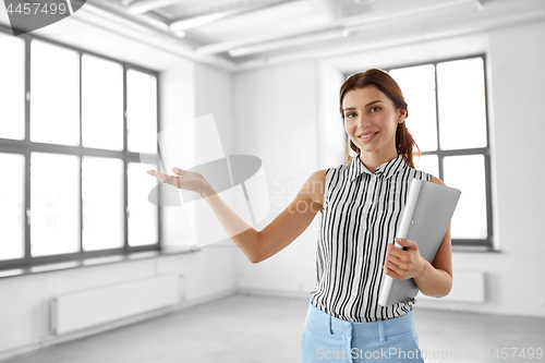 Image of businesswoman or realtor with folder at office