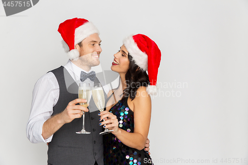 Image of couple with champagne glasses at christmas party