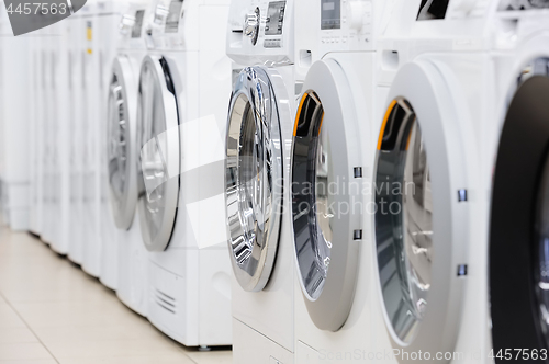 Image of washing mashines in appliance store