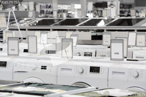 Image of washing mashines in appliance store showroom