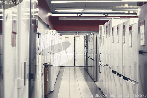 Image of rows of refrigerators in appliance store