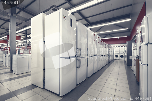 Image of refrigerators and washing mashines in appliance store