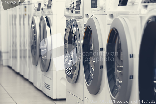 Image of washing mashines in appliance store