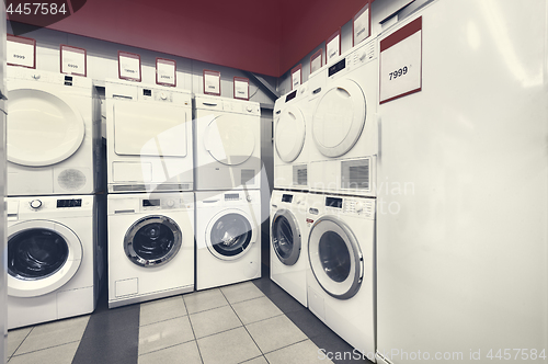 Image of washing mashines in appliance store