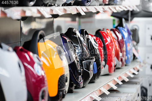 Image of Row of vacuum cleaners in appliance store