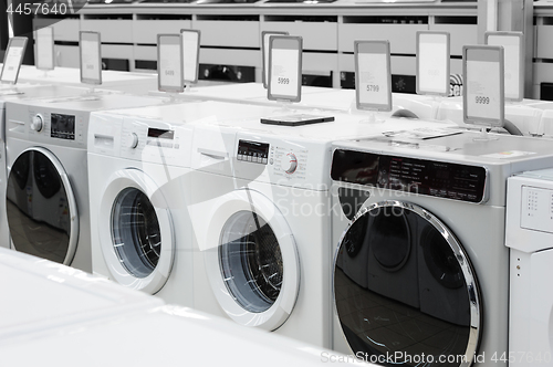 Image of washing mashines in appliance store