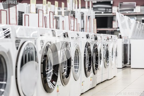 Image of washing mashines in appliance store