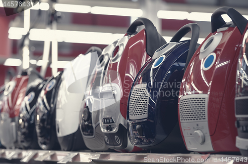 Image of Row of vacuum cleaners in appliance store