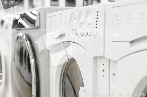 Image of washing mashines in appliance store