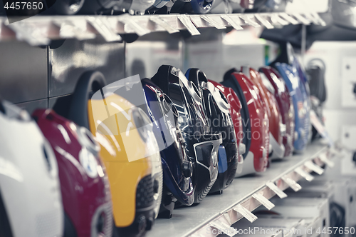 Image of Row of vacuum cleaners in appliance store