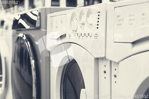 Image of washing mashines in appliance store