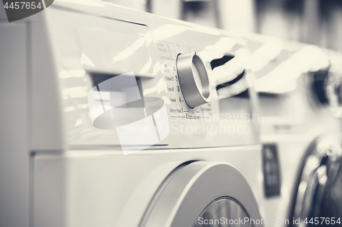 Image of washing mashines closeup in appliance store