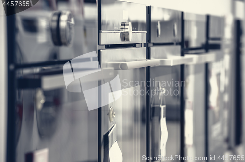 Image of Brand new electric ovens at appliance store