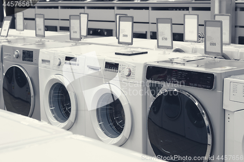 Image of washing mashines in appliance store