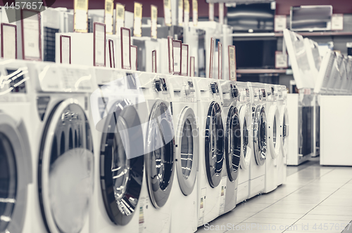 Image of washing mashines in appliance store