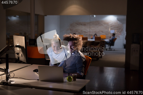 Image of young designers in the night office