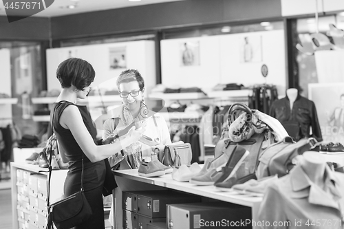 Image of best friend shopping in big mall