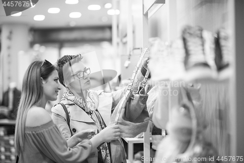 Image of best friend shopping in big mall