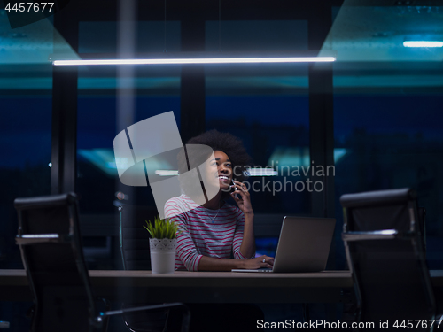 Image of black businesswoman using a laptop in startup office