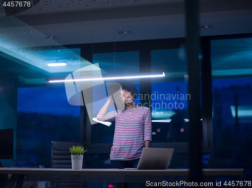 Image of black businesswoman using a laptop in startup office