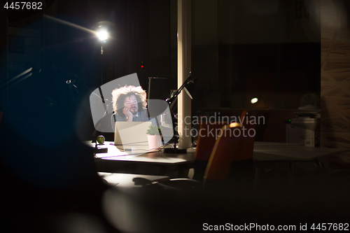 Image of businessman relaxing at the desk