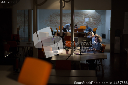 Image of young designers in the night office