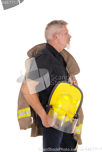 Image of A firefighter standing in profile 