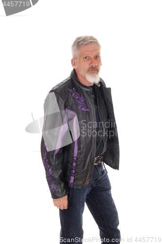 Image of Middle age man standing with jacket